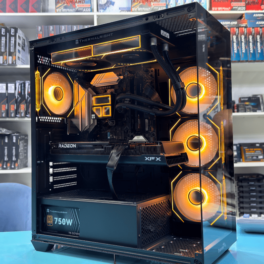 Open computer case with visible components on a table in a store setting