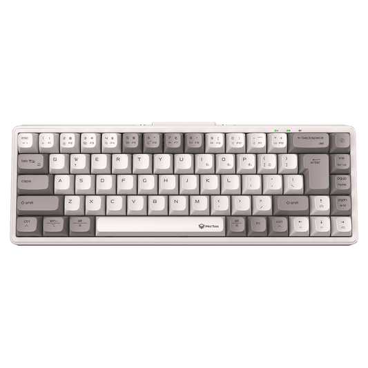 Mechanical keyboard with gray and white keys on a green background